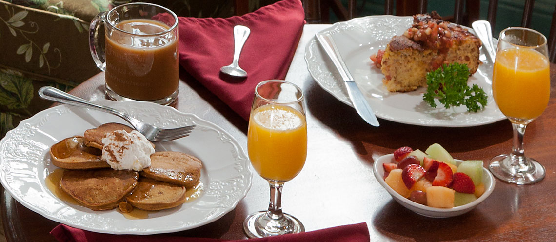 breakfast plates of pancakes and quiche